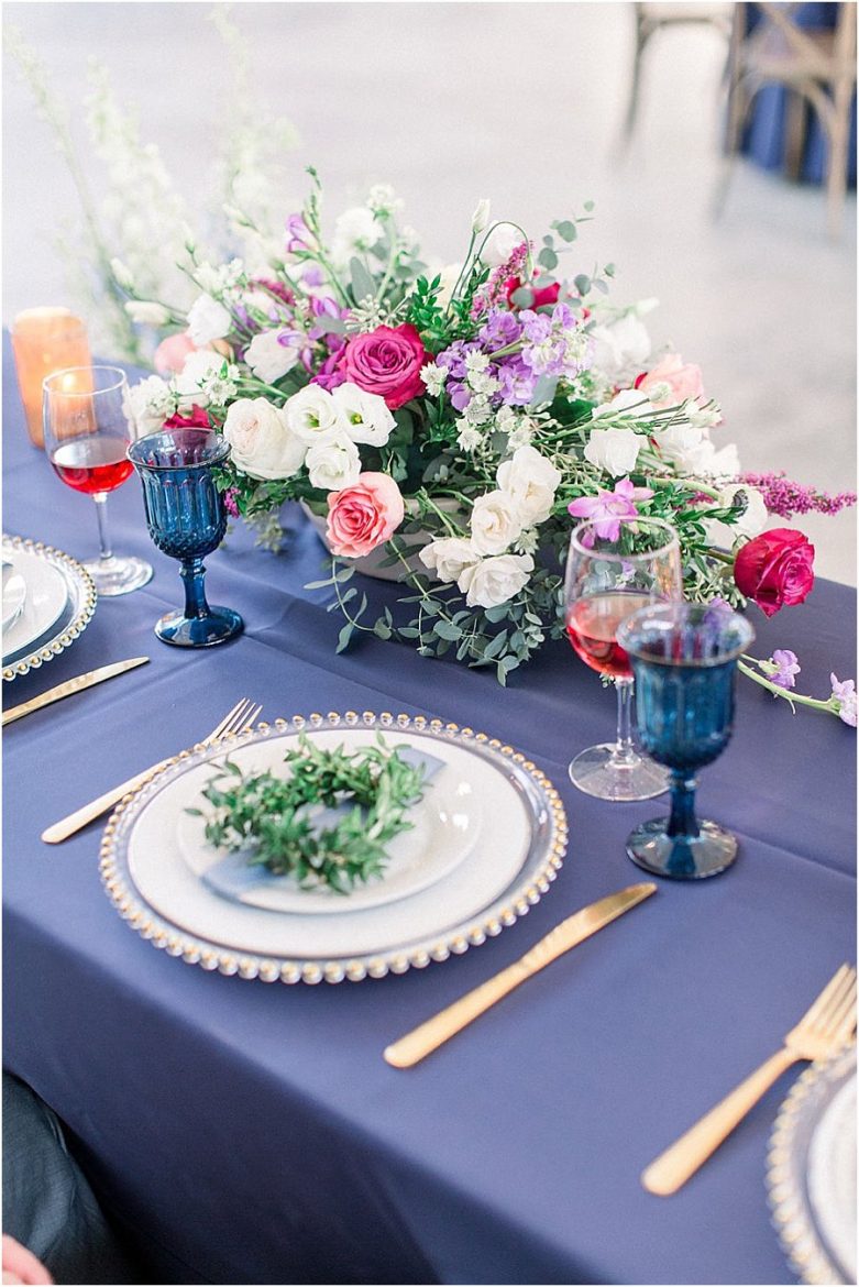 Bright Preppy Garden Wedding head table place setting, boxwood wreath, centerpiece, spring, blue glassware, gold flatware